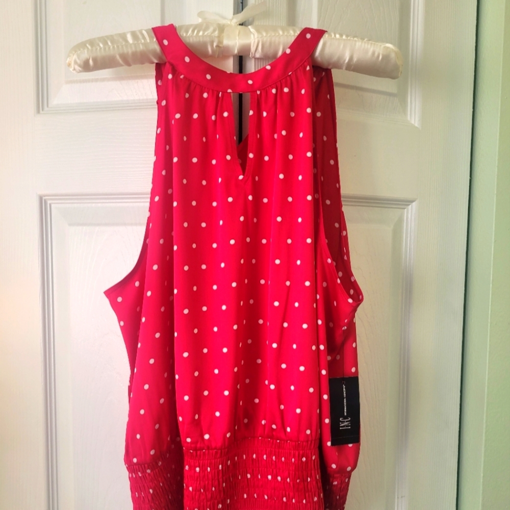 Super fun Sleeveless pink top with white dots.